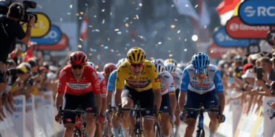 Cyclists in a dramatic photo finish sprint at the finish line